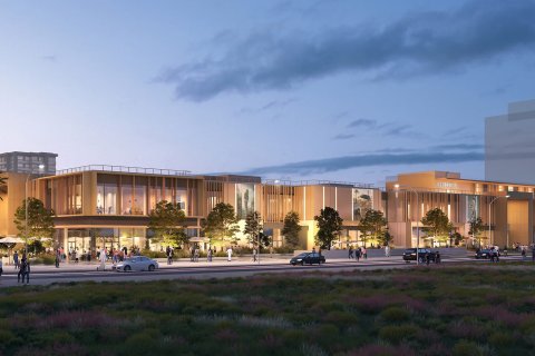 A new shopping centre with open galleries and lagoon views will open in Dubai South