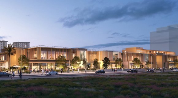 A new shopping centre with open galleries and lagoon views will open in Dubai South